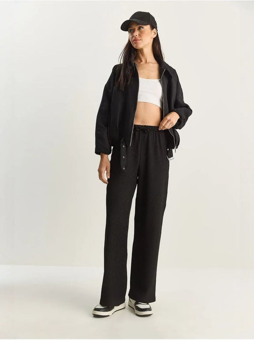 Broek met hoge taille en wijde pijpen lucci - Kiabi Broek met hoge taille en wijde pijpen lucci - Kiabi