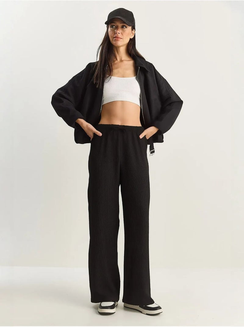 Broek met hoge taille en wijde pijpen lucci Zwart - Kiabi