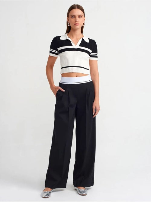 Broek met hoge taille en wijde pijpen van crêpe dilvin - Kiabi Broek met hoge taille en wijde pijpen van crêpe dilvin - Kiabi