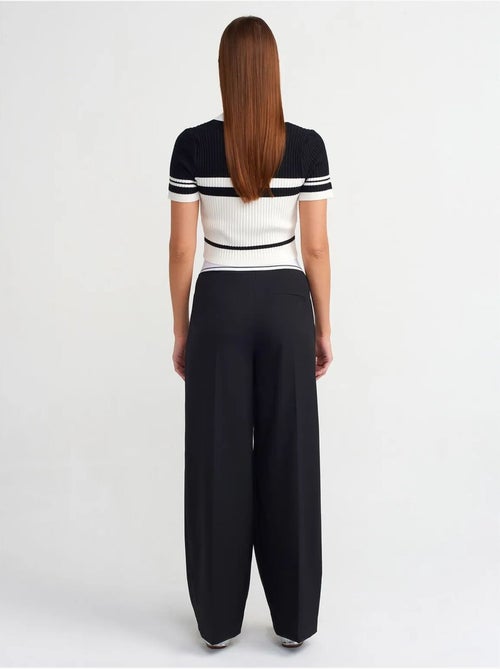 Broek met hoge taille en wijde pijpen van crêpe dilvin - Kiabi Broek met hoge taille en wijde pijpen van crêpe dilvin - Kiabi