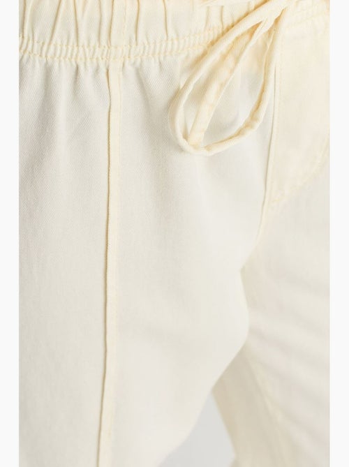Broek met hoge taille, wijde pijp en strik dilvin - Kiabi Broek met hoge taille, wijde pijp en strik dilvin - Kiabi