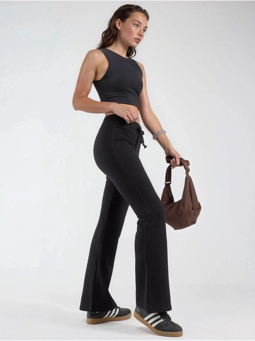 Broek met uitlopende pijpen en elastische taille busem - Kiabi Broek met uitlopende pijpen en elastische taille busem - Kiabi