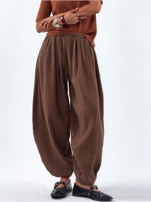 Broek met wijde pijpen en elastische taille busem - Kiabi Broek met wijde pijpen en elastische taille busem - Kiabi