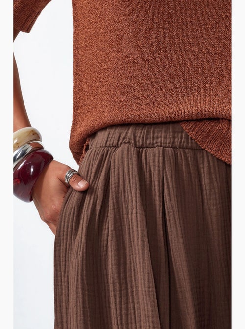 Broek met wijde pijpen en elastische taille busem - Kiabi Broek met wijde pijpen en elastische taille busem - Kiabi