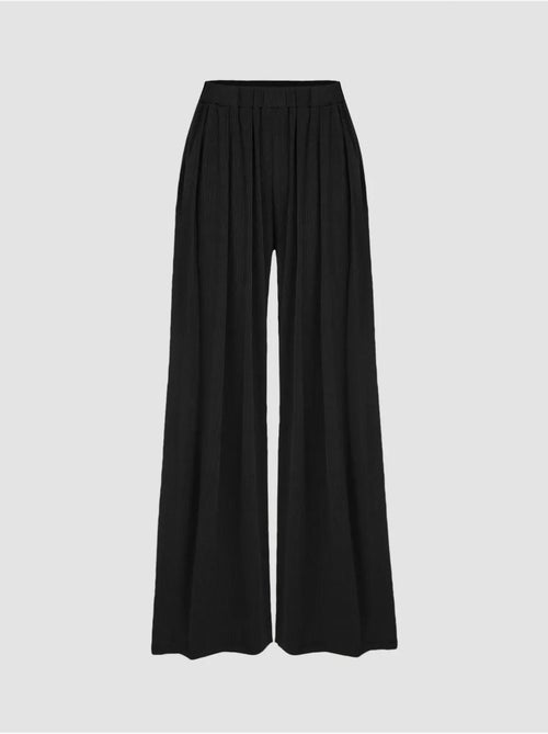 Broek met wijde pijpen en elastische taille - Kiabi Broek met wijde pijpen en elastische taille - Kiabi