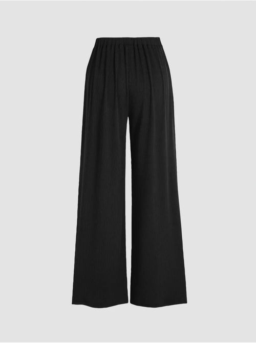 Broek met wijde pijpen en elastische taille - Kiabi Broek met wijde pijpen en elastische taille - Kiabi