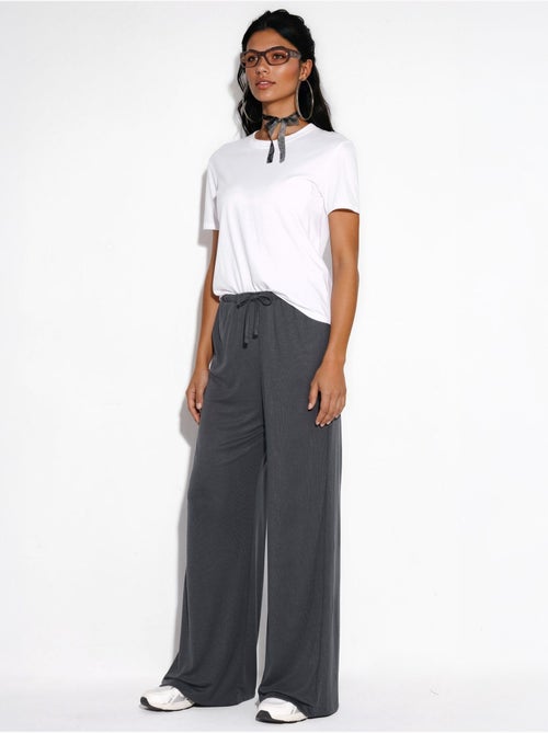 Broek met wijde pijpen en trekkoord busem - Kiabi Broek met wijde pijpen en trekkoord busem - Kiabi