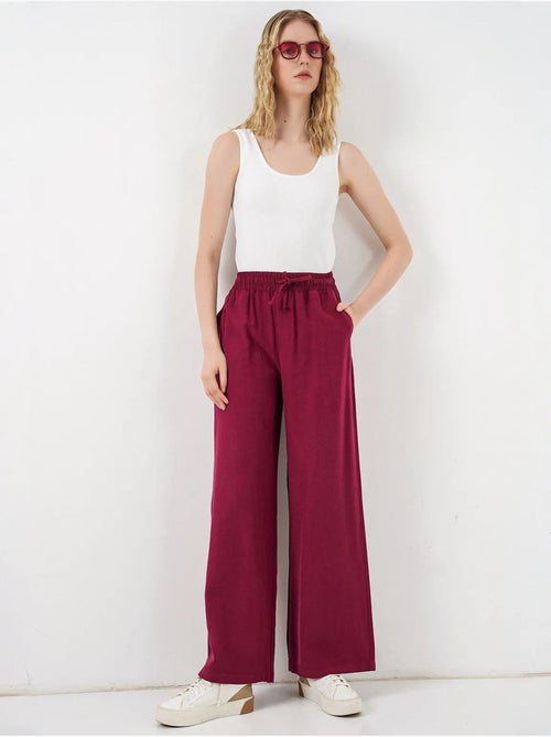 Broek met wijde pijpen, hoge taille en zak bdart - Kiabi Broek met wijde pijpen, hoge taille en zak bdart - Kiabi
