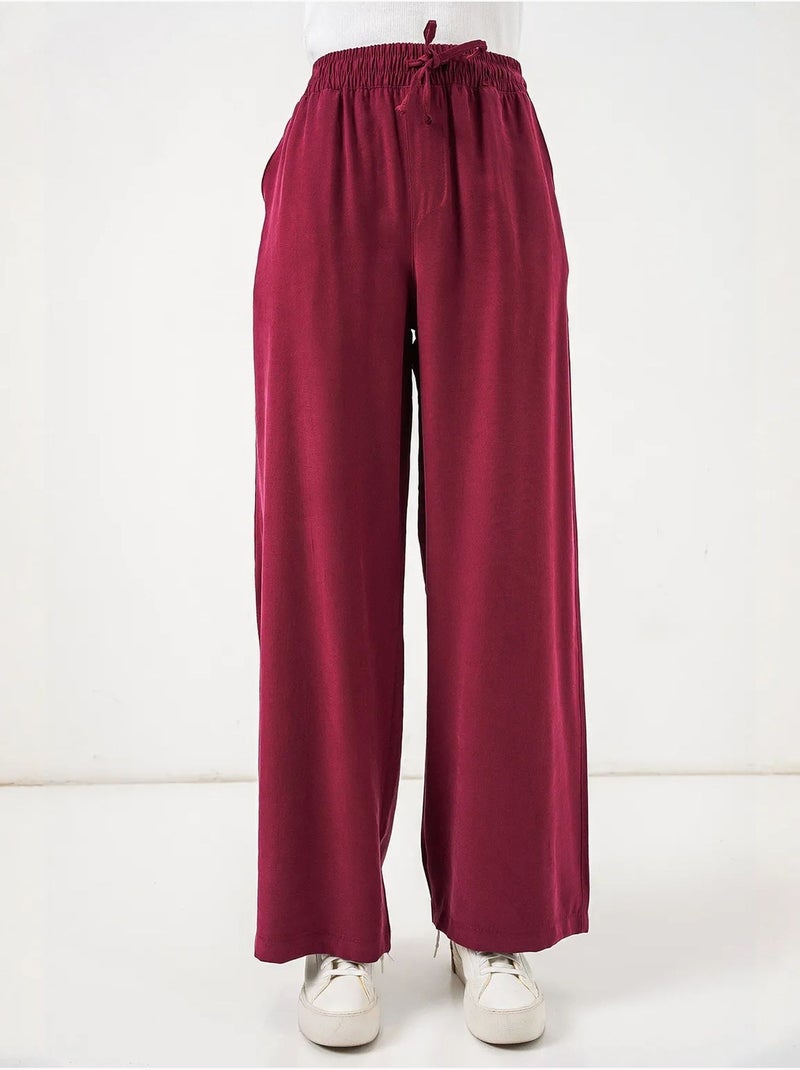 Broek met wijde pijpen, hoge taille en zak bdart Bordeauxrood - Kiabi