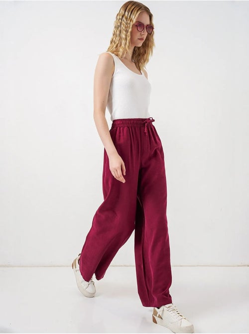 Broek met wijde pijpen, hoge taille en zak bdart - Kiabi Broek met wijde pijpen, hoge taille en zak bdart - Kiabi