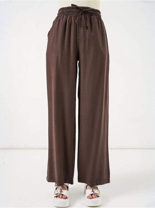 Broek met wijde pijpen, hoge taille en zak bdart - Kiabi Broek met wijde pijpen, hoge taille en zak bdart - Kiabi
