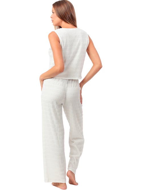 Broekpak en mouwloze top halter style - Kiabi Broekpak en mouwloze top halter style - Kiabi
