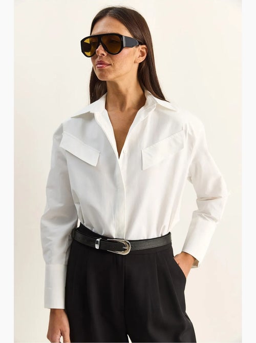 Chemise décontractée en popeline boutonnée à manches longues avec poche lucci - Kiabi Chemise décontractée en popeline boutonnée à manches longues avec poche lucci - Kiabi