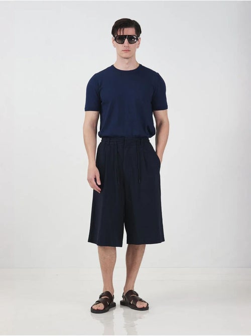 Chino-stijl lange shorts met wijde pijpen en trekkoord in de taille. Giesto - Kiabi Chino-stijl lange shorts met wijde pijpen en trekkoord in de taille. Giesto - Kiabi