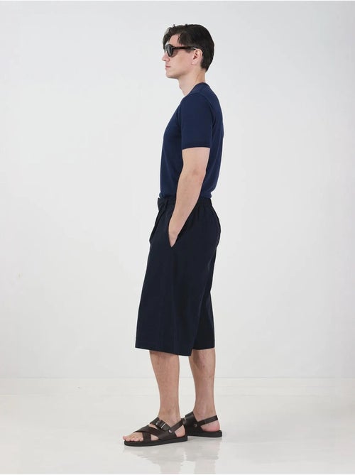 Chino-stijl lange shorts met wijde pijpen en trekkoord in de taille. Giesto - Kiabi Chino-stijl lange shorts met wijde pijpen en trekkoord in de taille. Giesto - Kiabi