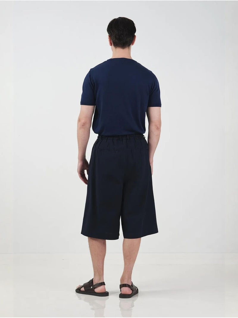 Chino-stijl lange shorts met wijde pijpen en trekkoord in de taille. Giesto Marineblauw - Kiabi