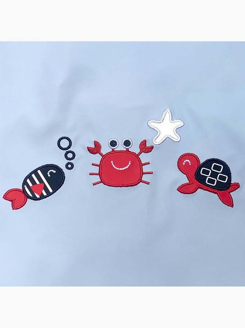 Ciré imperméable bébé avec Capuche 'Breizh Ocean', Poncho Intérieur rayé avec Broderie Bleu ciel - Kiabi