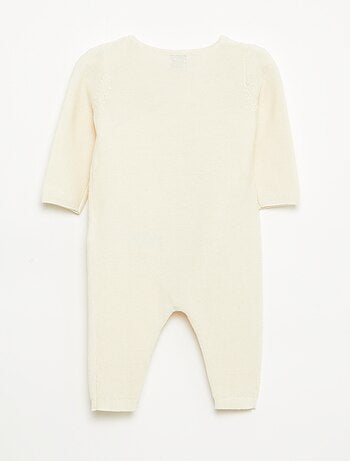 Combinaison en tricot avec ouverture cache-cœur