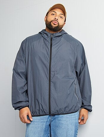 Coupe vent uni pliable dans la capuche