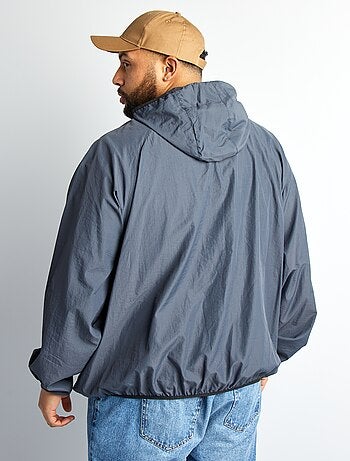 Coupe vent uni pliable dans la capuche