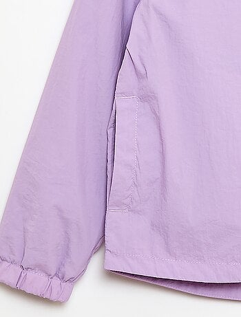 Coupe-vent uni pliable dans sa capuche