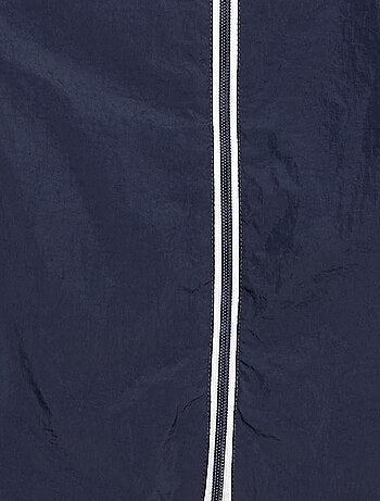 Coupe-vent uni qui se range dans sa capuche