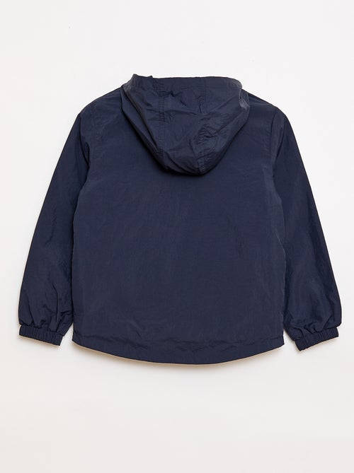 Coupe-vent uni qui se range dans sa capuche - Kiabi