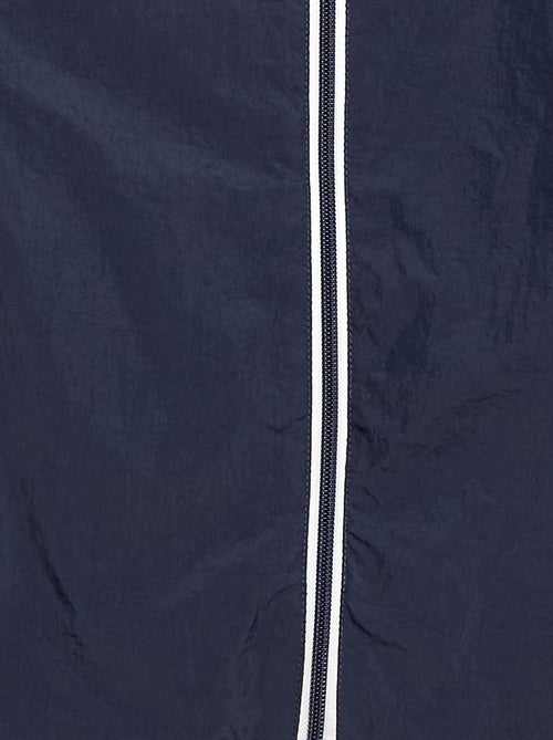 Coupe-vent uni qui se range dans sa capuche - Kiabi