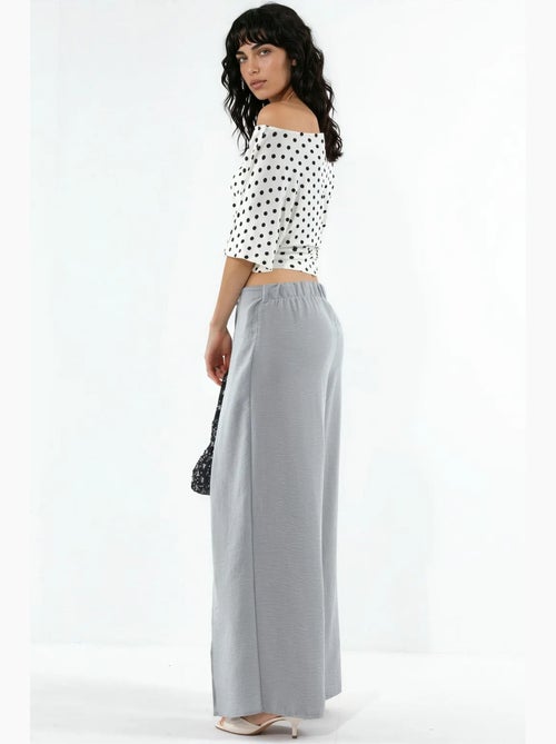 Crêpe broek met trekkoord in de taille en strikdetail busem - Kiabi Crêpe broek met trekkoord in de taille en strikdetail busem - Kiabi