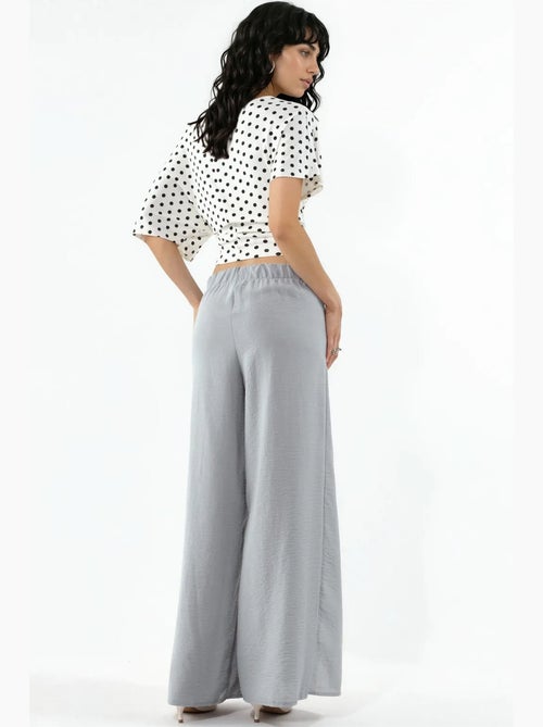 Crêpe broek met trekkoord in de taille en strikdetail busem - Kiabi Crêpe broek met trekkoord in de taille en strikdetail busem - Kiabi