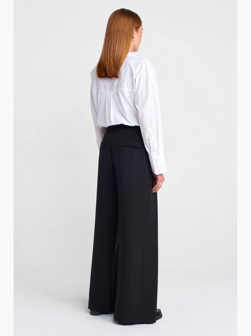 Dames broek met hoge taille en wijde pijpen van crêpe dilvin - Kiabi Dames broek met hoge taille en wijde pijpen van crêpe dilvin - Kiabi