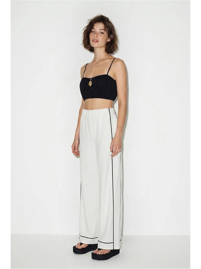 Dames jersey broek met hoge taille en wijde pijp lucci Gebroken wit - Kiabi