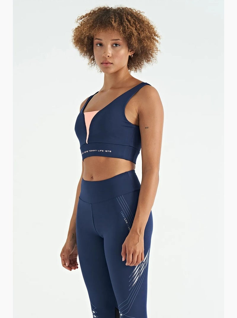 Dames sporttop met kleurvlakken en cropped model tommy Blauw Roze - Kiabi