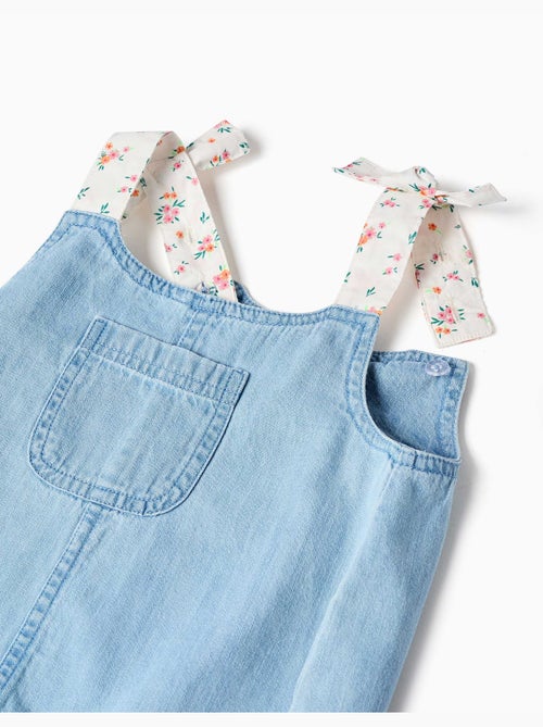 Denim jumpsuit met bloemenbandjes - Kiabi Denim jumpsuit met bloemenbandjes - Kiabi