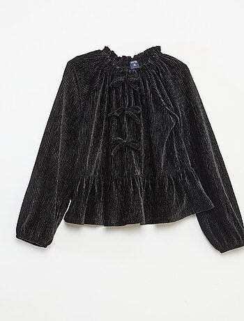 Een feestelijk, effen T-shirt met textuur en strik