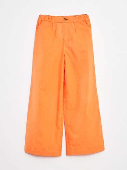 Een kleurrijke broek met wijde pijpen - Kiabi