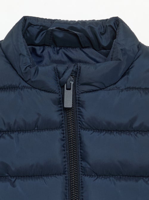 Effen mouwloze gewatteerde bodywarmer - Kiabi Effen mouwloze gewatteerde bodywarmer - Kiabi