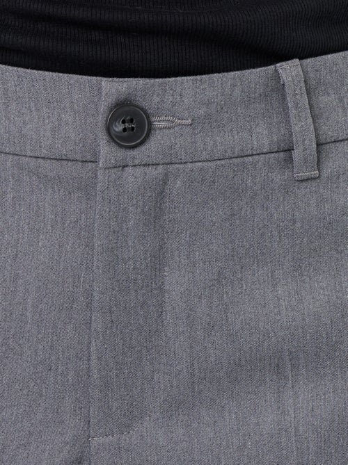 Effen, soepelvallende broek met wijde pijpen - Kiabi Effen, soepelvallende broek met wijde pijpen - Kiabi