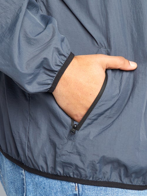 Effen windjack, opvouwbaar in de capuchon - Kiabi