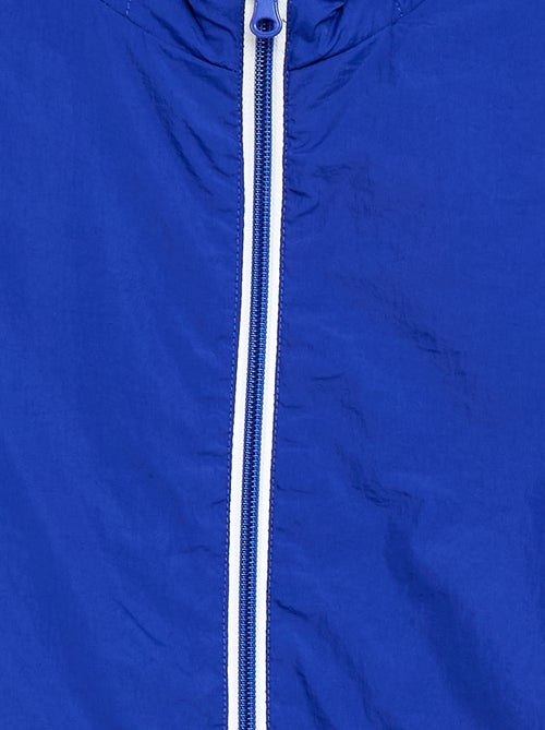 Effen windjas dat in de capuchon kan worden opgeborgen - Kiabi