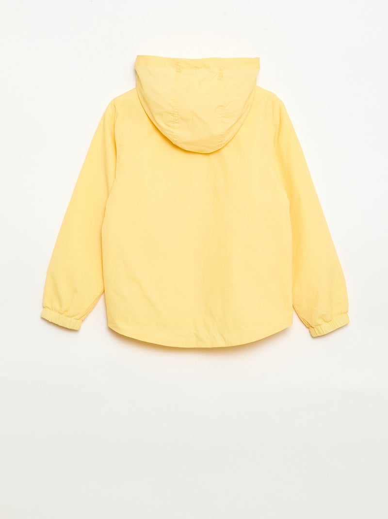 Effen windjas dat in de capuchon kan worden opgeborgen Geel - Kiabi