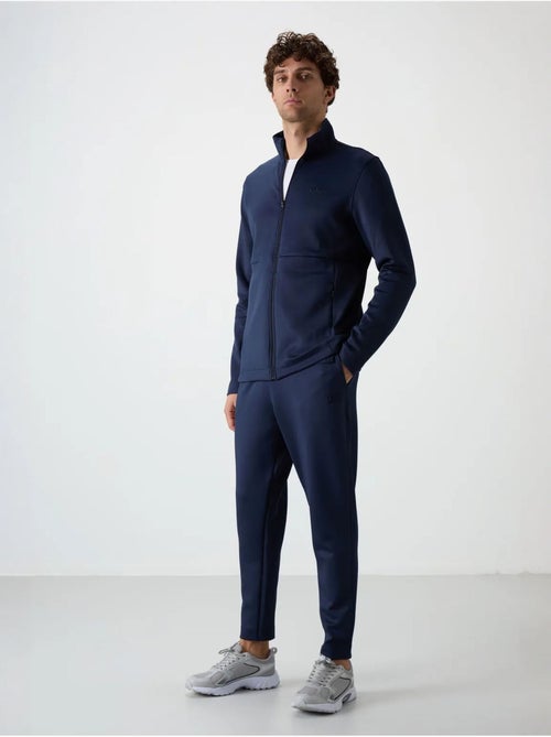Ensemble de sport homme en scuba, col zippé tommy - Kiabi Ensemble de sport homme en scuba, col zippé tommy - Kiabi
