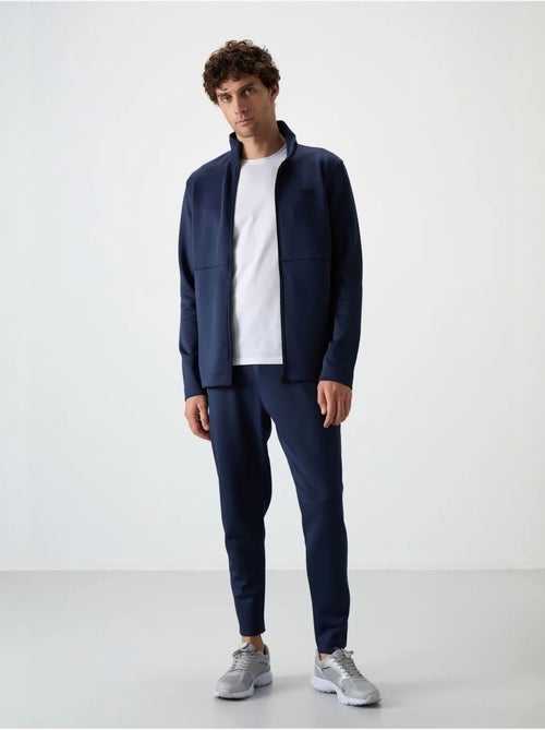 Ensemble de sport homme en scuba, col zippé tommy - Kiabi Ensemble de sport homme en scuba, col zippé tommy - Kiabi