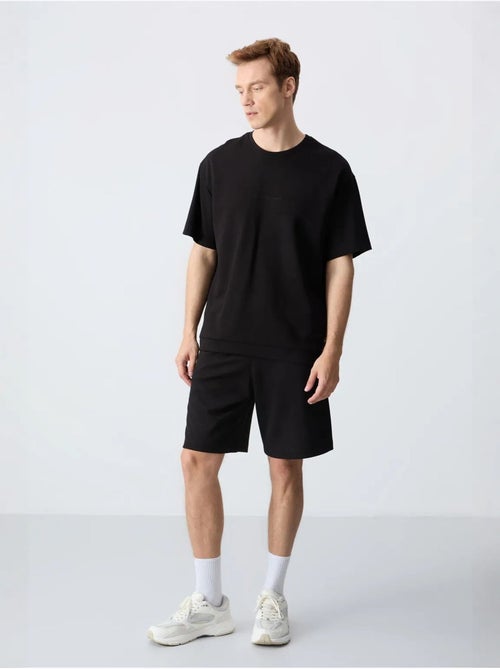 Ensemble homme t-shirt oversize et short en coton mélangé tommy - Kiabi Ensemble homme t-shirt oversize et short en coton mélangé tommy - Kiabi