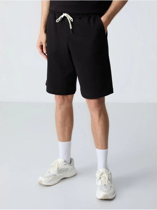 Ensemble homme t-shirt oversize et short en coton mélangé tommy - Kiabi Ensemble homme t-shirt oversize et short en coton mélangé tommy - Kiabi