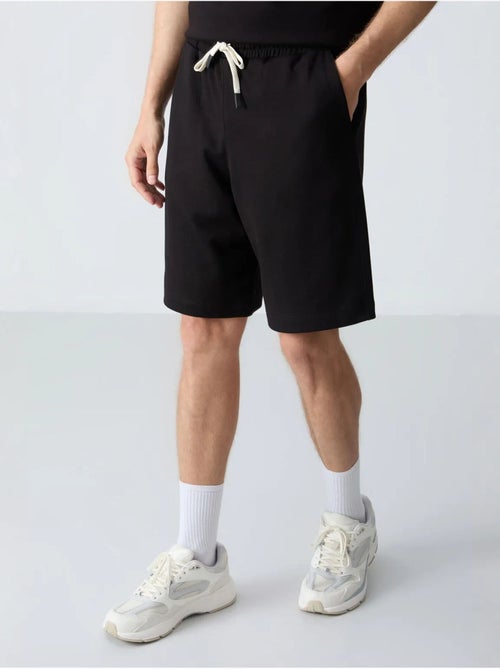 Ensemble homme t-shirt oversize et short en coton mélangé tommy - Kiabi Ensemble homme t-shirt oversize et short en coton mélangé tommy - Kiabi