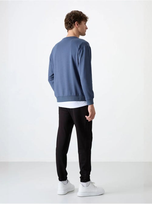 Ensemble sweat et pantalon oversize col rond tommy - Kiabi Ensemble sweat et pantalon oversize col rond tommy - Kiabi