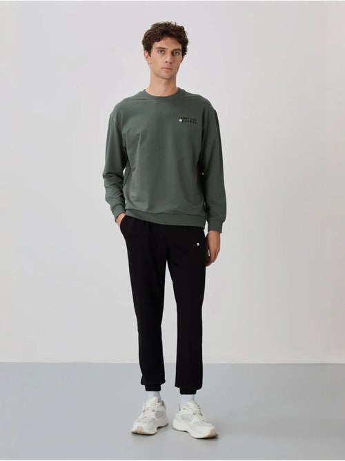 Ensemble sweat et pantalon oversize col rond tommy - Kiabi Ensemble sweat et pantalon oversize col rond tommy - Kiabi