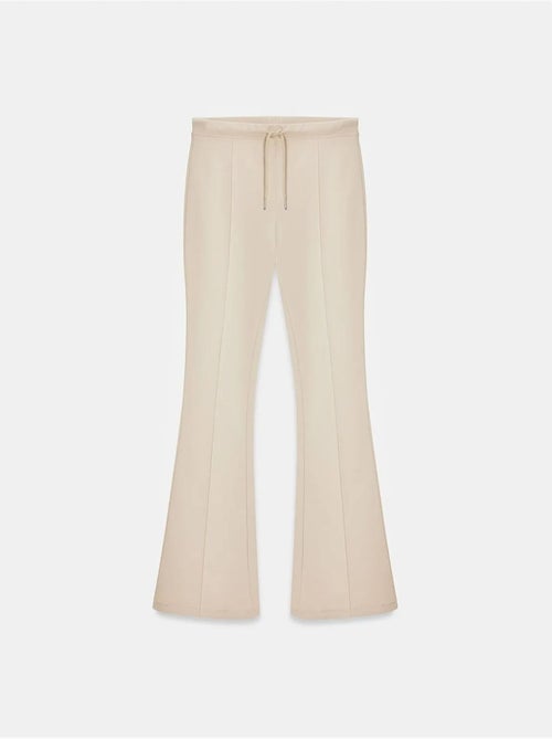 Flared jerseybroek met middelhoge taille en trekkoord dilvin - Kiabi Flared jerseybroek met middelhoge taille en trekkoord dilvin - Kiabi