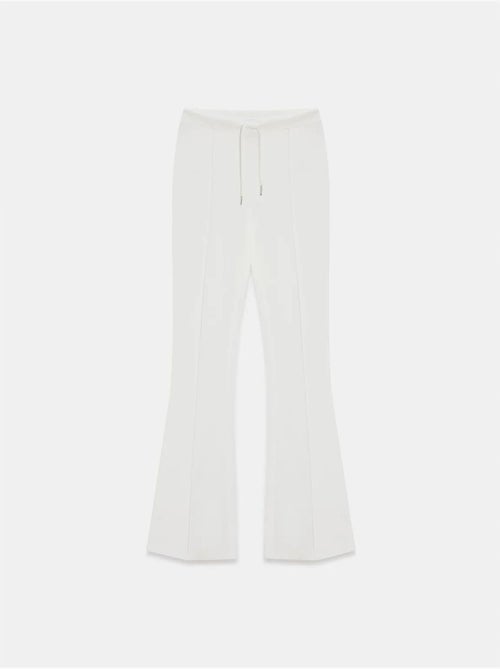 Flared jerseybroek met middelhoge taille en trekkoord dilvin - Kiabi Flared jerseybroek met middelhoge taille en trekkoord dilvin - Kiabi